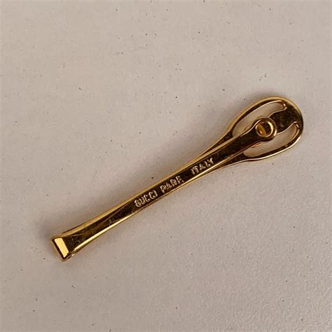 gold gucci tie clip|vintage gucci tie.